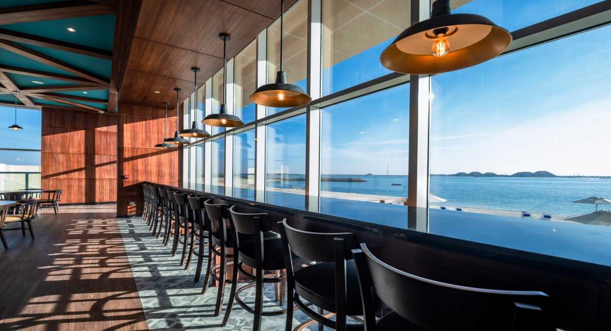 Take a break in our beach-facing sports bar featuring retro-inspired décor, pub games, and your favorite comfort foods!